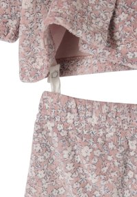 Pink floral two-piece set in textured fabric with soft white flowers, featuring ruffled sleeves and elastic waistband for comfort.