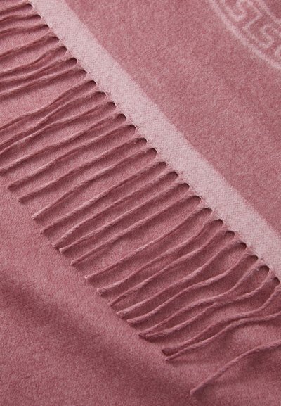 Écharpe en laine dans une douce teinte rose avec une texture subtile, dotée de longues franges le long d'un bord et d'un motif monochrome sur le tissu.