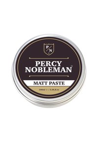 Ronde zilveren blik met een zwart en gouden label. De tekst luidt "Percy Nobleman Matt Paste" en geeft een volume aan van 100ml.