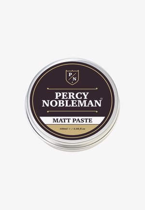 Rundes silbernes Dose mit einem schwarz-goldenen Etikett. Der Text lautet "Percy Nobleman Matt Paste" und gibt ein Volumen von 100ml an.