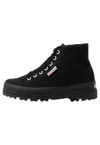 Black high-top canvas sneaker with a rubber sole, featuring white eyelets, a branded tag, and textured fabric for durability.