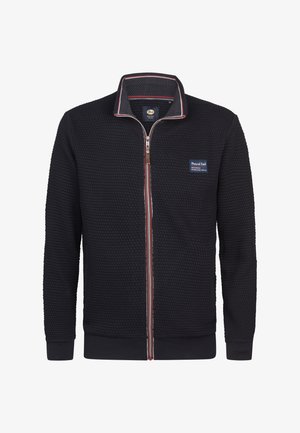 Marineblaue Zip-Up-Jacke mit Honigwabenstruktur, geripptem Kragen und Bündchen sowie gestreiften Akzenten entlang des Reißverschlusses. Mit einem Logo-Patch auf der Brust.