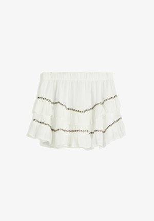 White ruffled skirt featuring an elastic waistband and horizontal bands of metallic accents on layered fabric. Soft, lightweight texture.