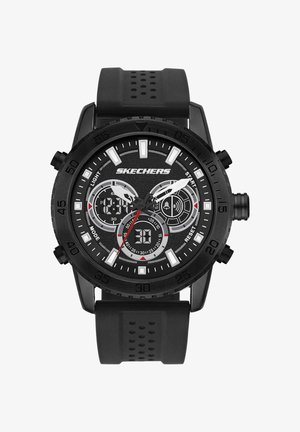 Montre-bracelet noire Skechers avec affichages analogique et numérique, marqueurs d'heure blancs, trois sous-cadrans et un bracelet en caoutchouc noir perforé.
