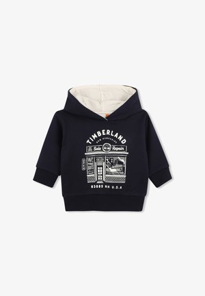 Marineblauwe hoodie voor peuters met beige voering, Timberland winkelgrafiek en tekst met de tekst "Timberland New Hampshire" in witte druk.