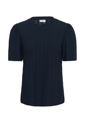 Blouse bleu marine à manches courtes bouffantes, avec un motif discret en œillets et un col rond.