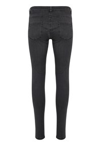 Jean noir slim avec deux poches arrière, passants de ceinture et détails cousus, présenté de dos sur un fond blanc.