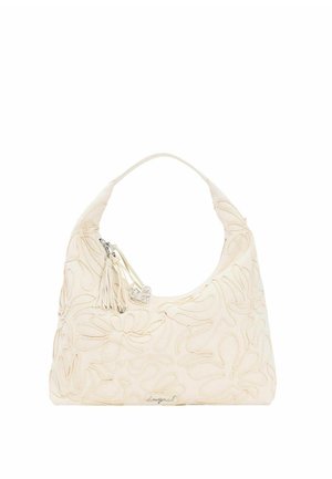 Cremefarvet håndtaske med blomsterbroderi, enkelt håndtag, kvast og sølv hjertevedhæng fastgjort til lynlåseglideren.