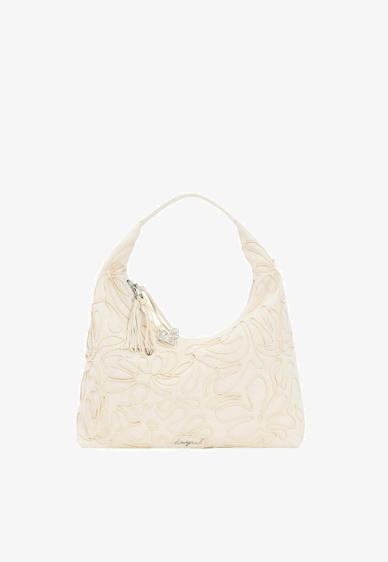 Sac à main crème avec broderie florale, une seule poignée, un pompon et un charm en forme de cœur argenté attaché à la tirette.