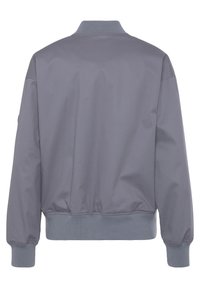Gray bomber jacket with ribbed collar and cuffs, featuring a smooth, matte texture and elastic hemline. Minimalistic design without embellishments.