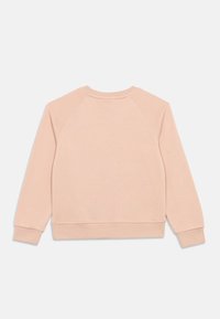 Růžová mikina vyrobená z měkké tkaniny, s kulatým výstřihem, žebrovanými manžetami a volným střihem, s raglánovými rukávy a bez viditelných grafických prvků.