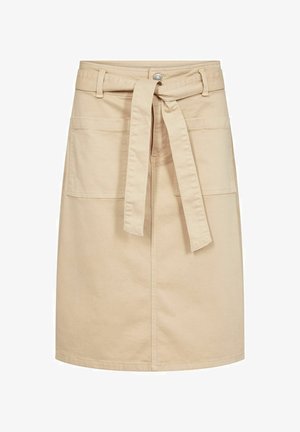 Beige puuvillane seelik, millel on ees- ja tagataskud, vööga, mis on kinni seotud, ning põlvekohale ulatuv sirge lõige. Sile tekstuur ja minimalistlik disain.