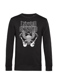 Camisa negra de mangas largas con un gráfico impreso en blanco que incluye "Lynyrd Skynyrd", un águila y guitarras. Tejido suave con cuello redondo acanalado.