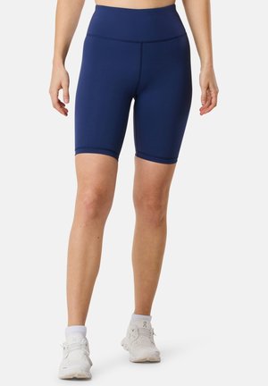 Navyblå högmidjade cykelshorts gjorda av stretchigt tyg, med en slät yta och minimala sömdetaljer.