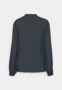 Blusa a maniche lunghe blu navy realizzata in tessuto trasparente con motivo a pois in rilievo, caratterizzata da un collo rotondo e polsini con bottoni.