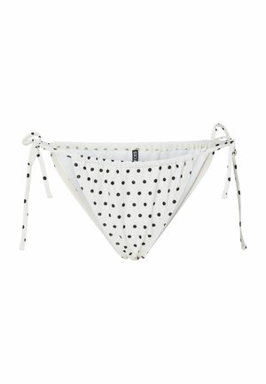 Valkoinen bikinihousu mustilla pallokuvioilla, sivusolmuiset, ja pieni musta merkkilappu etumaisen vyötärönauhan keskellä.