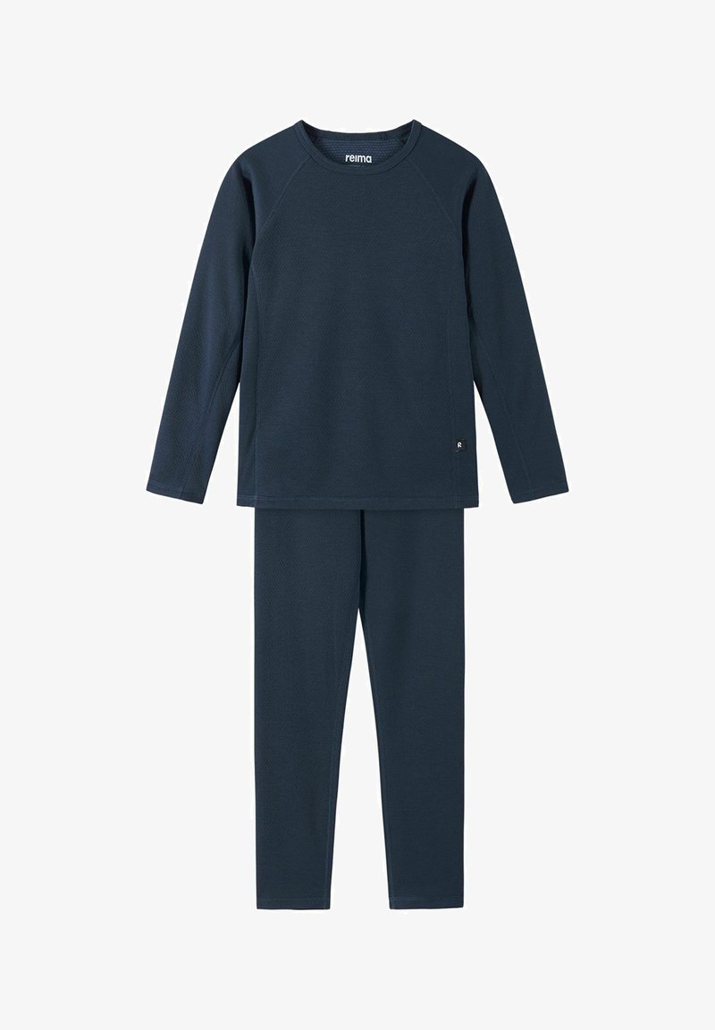 Granatowa bluzka z długim rękawem o teksturowanym wykończeniu oraz dopasowane legginsy. Model z rękawami raglanowymi i małą metką z logo na bluzce.