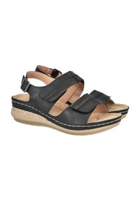 Sandalias negras de punta abierta con tres correas ajustables de Velcro, parte superior texturizada, plantillas acolchadas y una suela baja de cuña con un acento brillante.