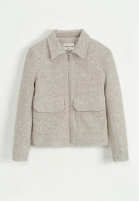 Veste en laine gris clair avec fermeture éclair, col pointu et deux poches avant. Texture douce avec un motif subtilement moucheté.