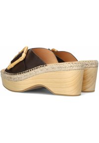 Brown leather platform sandals with a woven jute trim, wooden heel, and bamboo accent buckle. Smooth texture and contoured design.