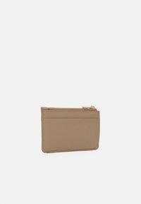Card holder in beige synthetic leather, featuring multiple card slots and a zippered pocket. Smooth texture with subtle stitching details.