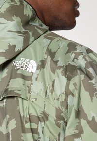 The North Face MOUNTAIN ATHLETICS - Windbreakers - new taupe/green