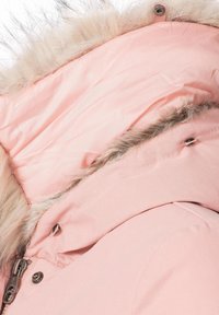Pink insulated coat collar featuring a soft faux fur trim, smooth inner lining, and metal snap closure. Stitching detail along the edge.