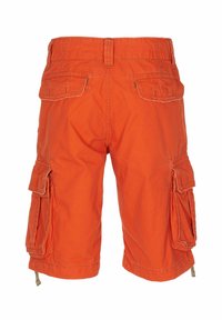 Pantaloni cargo arancioni realizzati in tessuto di cotone, dotati di molteplici tasche laterali, dettagli nei punti di cucitura e una vestibilità comoda.