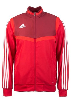 Veste de survêtement Adidas rouge avec poitrine supérieure bordeaux, bandes blanches sur les manches et fermeture éclair intégrale devant.