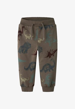 Braune Kleinkinderhose mit geripptem Bund und Bündchen, verziert mit blauen, grünen und braunen Dinosaurier-Prints und einem vorderen Kordelzug.