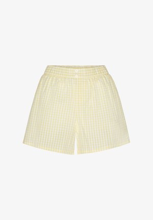 Lichtgele en witte geruite elastische taillebroekjes met twee witte knopen aan de voorkant.