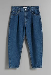 Denim jeans in dark blue with a relaxed fit. Features include a button closure, five pockets, and visible stitching along the seams.