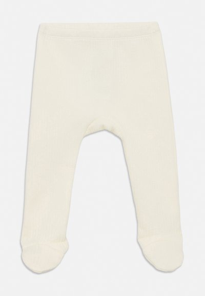 Pehmed koorevärvi beebipüksid, millel on jalad ja elastne vöökoht, mõeldud mugavuseks ja soojuseks.