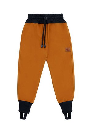 Spodnie dresowe w kolorze rdzy z czarnym elastycznym pasem, czarnymi mankietami z paskami na stopy oraz małą skórzaną naszywką na prawej udzie.