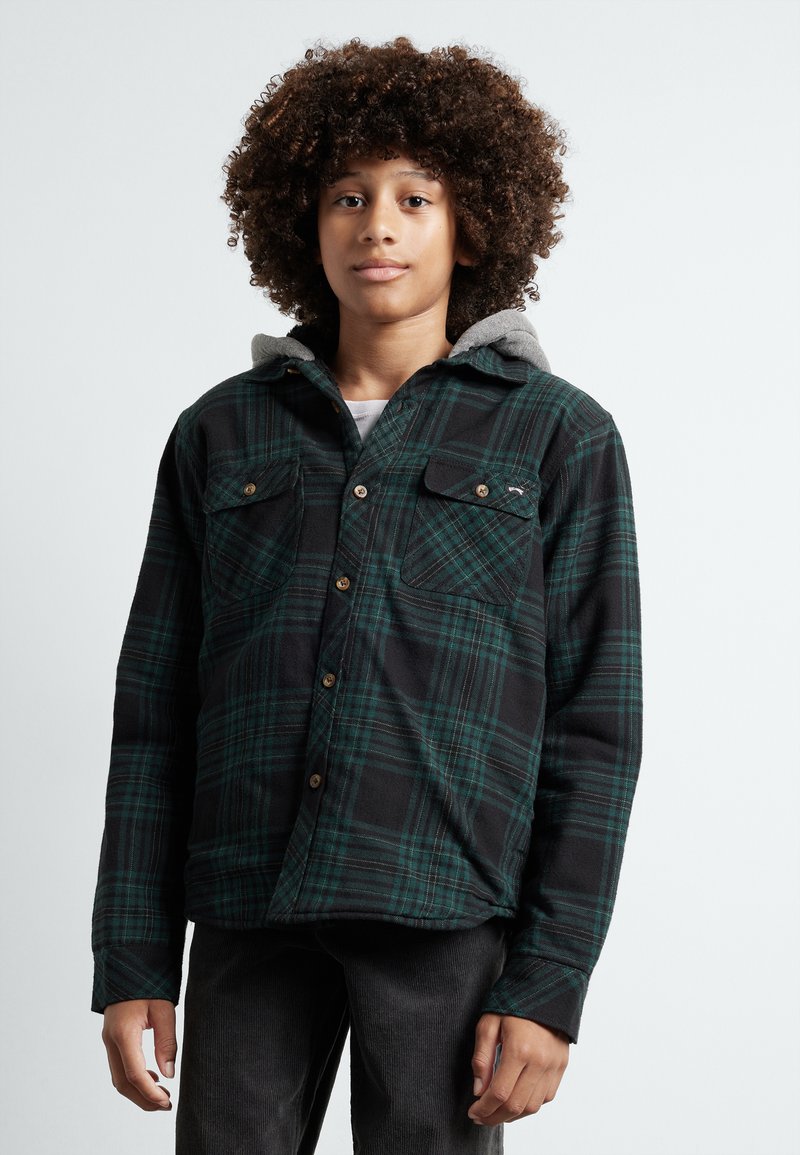 Black and green plaid flannel shirt with a grey hood, featuring button closure, two chest pockets, and a relaxed fit.