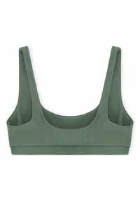 Zaļš sporta krūšturis ar plašām plecu siksnām, apaļu dekoltē un gludu, elastīgu audumu, ar minimālisma dizainu un bez aizdariem.