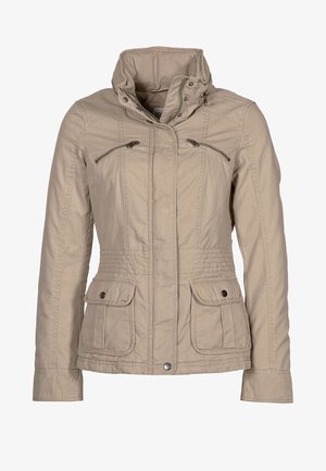 Béžová volná bunda s vysokým límcem, předním zipem, dvěma zipovými kapsami na hrudi a dvěma klopovými kapsami s patentkami na bocích.