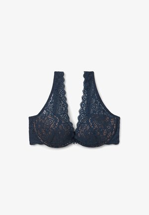 Soutien-gorge en dentelle bleu marine avec un décolleté plongeant, des bords festonnés et des motifs floraux. Comprend un support en fil métallique pour un maintien optimal et une finition lisse.