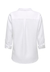Chemise blanche à manches longues avec col, poignets retroussés et texture lisse. Le dos présente une couture centrale et un design d'empiècement.