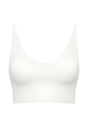 White seamless bralette with wide straps, scoop neckline, and smooth texture. Features minimal stitching and a fitted, wireless design.