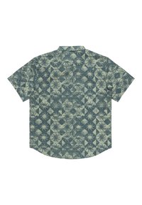 Chemise à manches courtes dans un motif géométrique vert et beige clair, avec des accents de feuilles de palmier et un col classique. Tissu doux, coupe décontractée.
