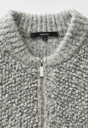Grau zip-up Cardigan aus strukturiertem Stoff mit grober Webart. Verfügt über einen hohen Kragen und silberne Reißverschlussdetails. Die Größenangabe lautet "36."