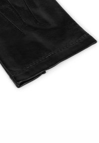 Gant en cuir noir avec une texture lisse, comportant des sections de doigts allongées et des détails de couture sur le bord. Replié au niveau du poignet pour un ajustement sûr.