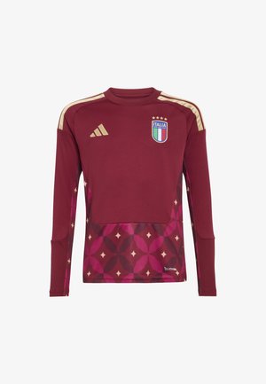 Maillot de sport à manches longues bordeaux avec des accents dorés, présentant une section inférieure à motifs dans des tons de rose et un emblème national sur la poitrine.