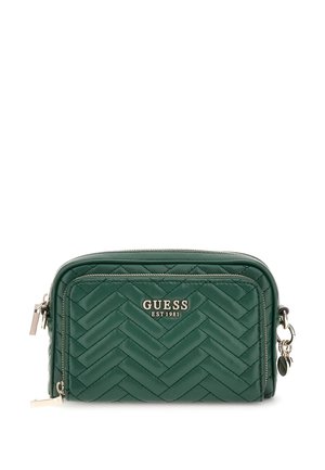 Besace verte en cuir matelassé avec un motif en chevrons, accastillage en argent et logo sur le devant.