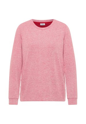 Suéter rosa de cuello redondo con mangas largas, tejido de punto texturizado y cremalleras laterales. Presenta un cuello interior en color rojo sólido que contrasta.
