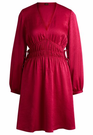 Fuksianen mekko pitkilla hihoilla, V-kaula-aukolla ja rypytetty vyötärö. Sisältää teksturoitua kangasta ja kiristysnauharakenteita vyötäröllä.