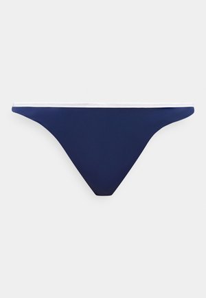Bas de bikini bleu marine avec bordure de taille blanche, présenté à plat sur un fond gris clair.