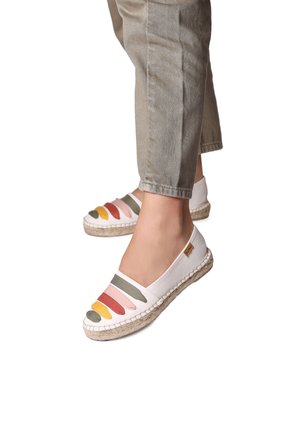 White fabric espadrilles with a jute sole, featuring multicolored stripes in green, pink, orange, and yellow across the toe area.