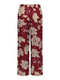Pantaloni rossi a gamba larga con grande stampa floreale beige e vita elastica.